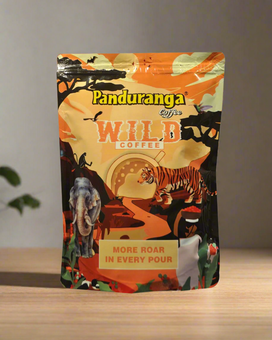 Packaging of Panduranga Wild Coffee with a colorful design featuring tigers and other wildlife in a forest setting.